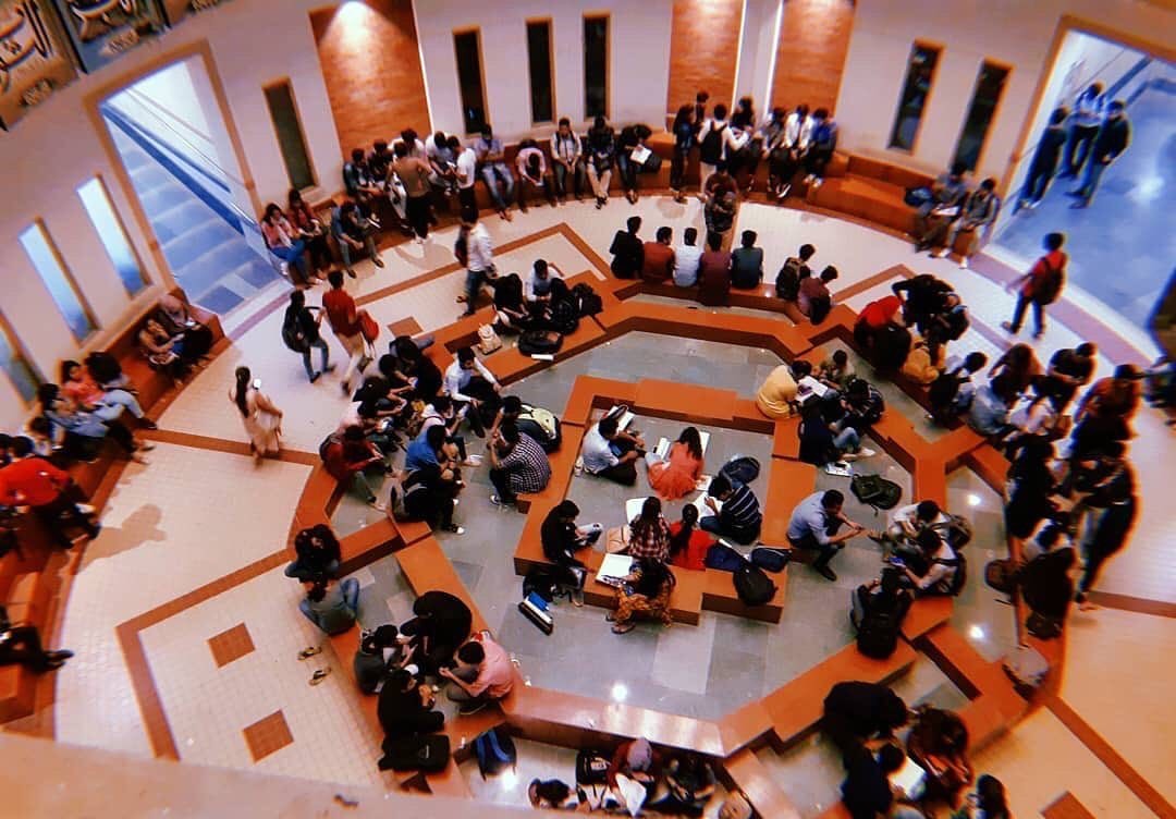 Workshop attendees gathered in a circular hall